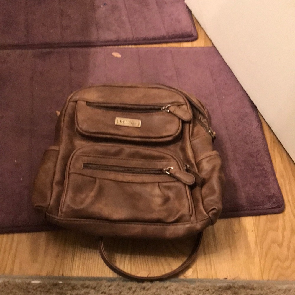 Anybody need a backpack purse to put their female belongings in